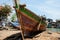 Fishing boat under repair replacing damaged wooden body parts