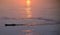 Fishing boat and wake pattern on irrawaddy river myanmar at sunrise