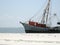 A fishing boat washed up on the beach after a hurricane in Biloxi Mississippi.