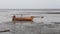 Fishing boat wreck lying on the sand and mud, Bangpu Recreation Center