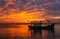 Fishing boats against the background of a purple sunset