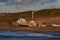 Fishing boats on the beach i the light of the sunset