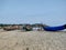 Fishing boats on beach with lighthouse