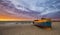 Fishing boats on the beach during a storm