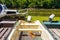 Fishing boats beached on overgrown river with duckweed.