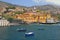 Fishing boats, city beach and ancient fortress. Funchal, Madeira, Portugal