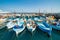 Fishing boats and ferry in Marina Grande, Capri Island, Italy