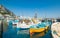 Fishing boats and ferry in Marina Grande, Capri Island, Italy