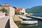 Fishing boats float moored in Perast town. Kotor Bay Montenegro.