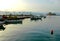 Fishing boats floating in the pretty harbor in Nafplio in Greece with Bourtzi Castle in the background