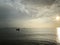 Fishing boats Floating on the sea during the evening time, overcast light To prepare for the sea creatures in the dark Is a backgr