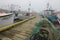 Fishing boats in foggy harbor of Saint Bride`s