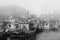 Fishing boats in foggy harbor of Saint Bride`s