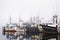 Fishing boats in harbor fog