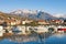 Fishing boats in harbor. Marina Kalimanj in Tivat town on a winter day with Lovcen mountain in the background, Montenegro