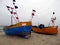 Fishing boats in the harbor pulled out on the beach