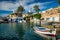 Fishing boats in harbour in fishing village of Mandrakia, Milos island, Greece