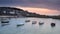 Fishing boats in harbour at sunrise