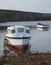 Fishing boats in harbour at sunrise long exposure image