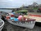 Fishing boats hauled up on stone beach