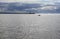 Fishing boats and lighthouse at the end of a fishermens crowded mole