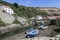 Fishing boats at low tide at Staithes, N. Yorks, England