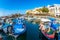 Fishing Boats moored in Kyrenia Girne harbour with restaurants