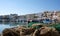 Fishing boats moored in the port in Trani, historic town in Puglia, Southern Italy. Photographed on a clear day in early autumn.