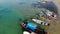 Fishing boats near shore. Various colorful fishing boats floating near coast on sea water in tropical country. Drone top view