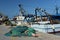 Fishing boats and nets in Trani, Apulia, Italy. View of the old port.