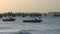 Fishing Boats in Ocean Bay Waves after Hurricane at Sunset