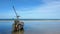 Fishing boats are parked on the beach with blue waters and blue skies on tropical landscapes.