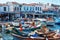 Fishing boats, restaurants and dining people at Urla Iskele port or harbor in Turkey. Travel landmarks of Turkey