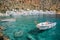 Fishing boats and the scenic village of Loutro in Crete Greece