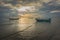 Fishing boats in the sea and a beautiful sky while the sunset.