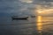 Fishing boats in the sea and beautiful sky while the sunset.