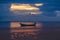 Fishing boats in the sea and beautiful sky while the sunset.