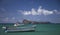 Fishing boats on the sea with a view of Coin de Mire in the background in Mauritius