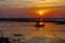 Fishing boats in the shadows sunset background