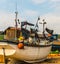 Fishing boats on the shore, stony beach, fishing industry,