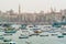 Fishing boats small and larger and Alexandrtia city  with Minarets