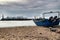 Fishing boats stranded on Aguda beach and Giant waves breaking on the breakwater