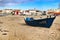 Fishing boats stranded on Aguda beach and little houses in the background