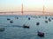 Fishing boats in sunset at the Puente de la ConstituciÃ³n, called La Pepa, in the bay of CÃ¡diz, Andalusia. Spain