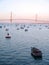 Fishing boats in sunset at the Puente de la ConstituciÃ³n, called La Pepa, in the bay of CÃ¡diz, Andalusia. Spain