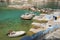 Fishing boats and Syrmata fishermans houses at Milos island in Greece