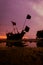 Fishing boats are waiting for high tide at sunset