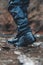 Fishing boots for wading in the river, fishing gloves water proof, shoes close-up in river