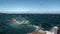 Fishing box cage in ocean background of waves in New Zealand.