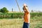 A fishing boy is fishing for a fishing rod, a happy and joyful guy on a river